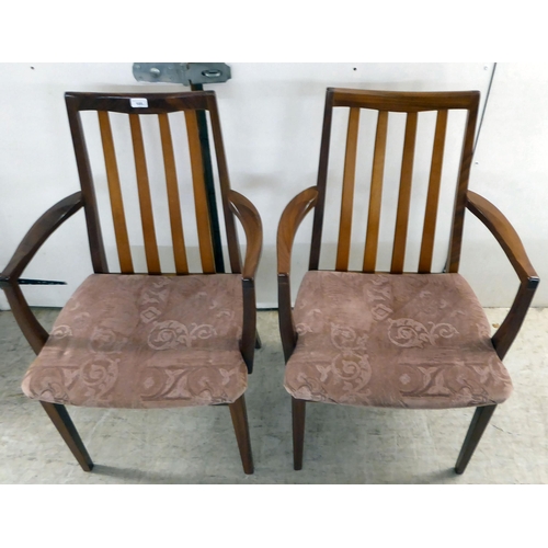 105 - A set of eight G-Plan teak framed dining chairs with upholstered seats, raised on square, tapered le... 