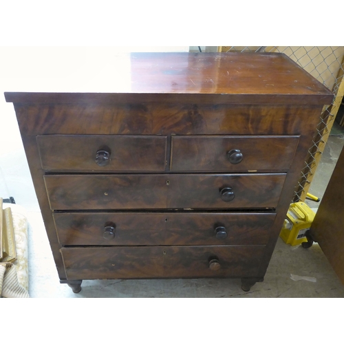 11 - A mid Victorian flame mahogany and mixed veneer, five drawer dressing chest, raised on turned feet  ... 