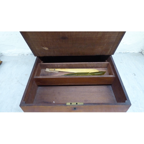 15 - An early/mid 20thC two-part mahogany desk top organiser, the upper section with eleven drawers, over... 