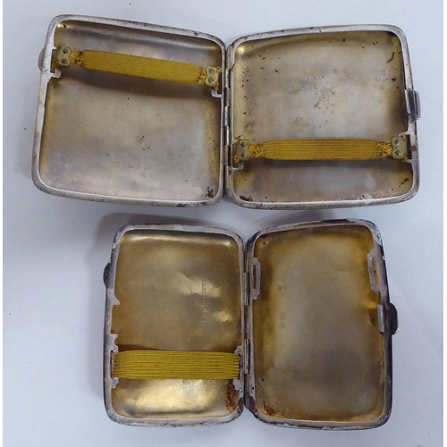 2 - Silver items: to include two bangles; and two cigarette cases  mixed marks  (approx. 5ozs ... 