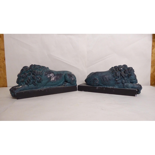 24 - A pair of 20thC overpainted, reconstituted stone recumbent lions, on plinths  5