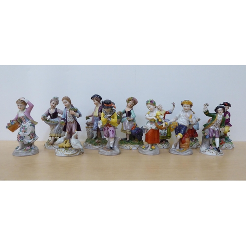 276 - Twelve 20thC Naples and other European porcelain figures, in traditional costume  largest 5