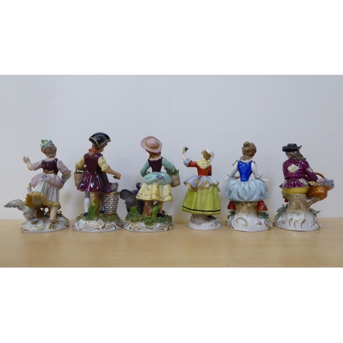 276 - Twelve 20thC Naples and other European porcelain figures, in traditional costume  largest 5