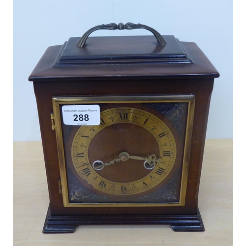 288 - A modern Smiths of Enfield mahogany cased mantel clock, on bracket feet; faced by a Roman dial  8