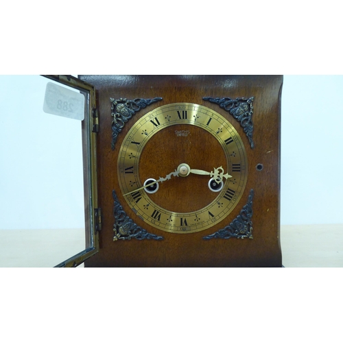 288 - A modern Smiths of Enfield mahogany cased mantel clock, on bracket feet; faced by a Roman dial  8