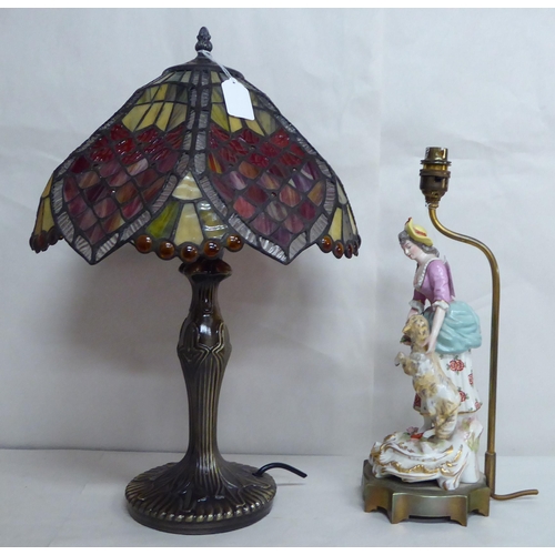 30 - A French porcelain table lamp, figure with a lamb; and another modern example with a Tiffany style s... 