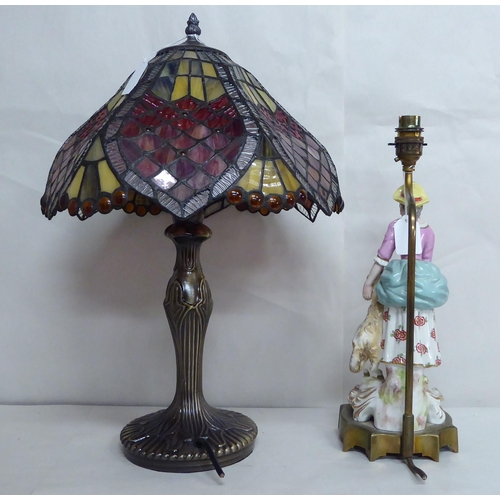 30 - A French porcelain table lamp, figure with a lamb; and another modern example with a Tiffany style s... 