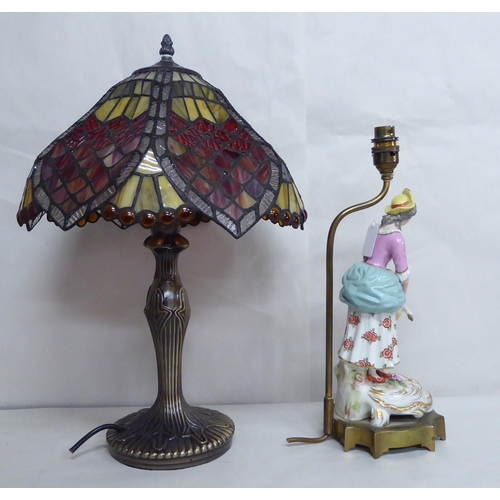 30 - A French porcelain table lamp, figure with a lamb; and another modern example with a Tiffany style s... 