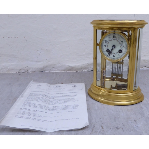 32 - A late 19th/early 20thC French four glass and brass cased clock; the 8 day mercury pendulum movement... 