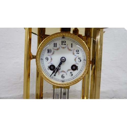 32 - A late 19th/early 20thC French four glass and brass cased clock; the 8 day mercury pendulum movement... 