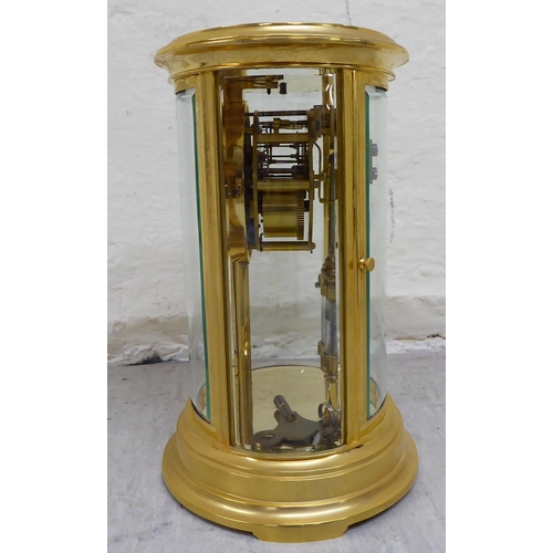 32 - A late 19th/early 20thC French four glass and brass cased clock; the 8 day mercury pendulum movement... 