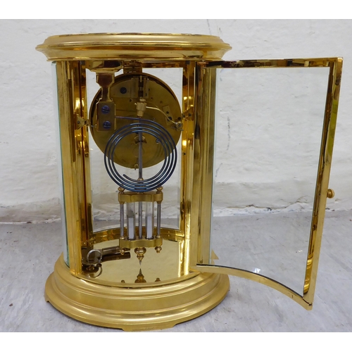 32 - A late 19th/early 20thC French four glass and brass cased clock; the 8 day mercury pendulum movement... 