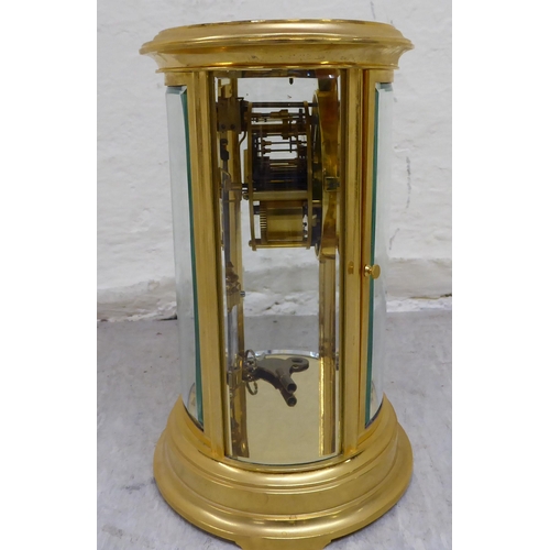 32 - A late 19th/early 20thC French four glass and brass cased clock; the 8 day mercury pendulum movement... 