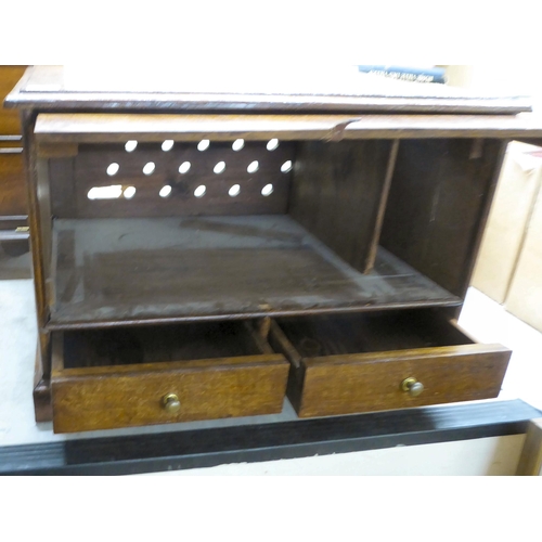 36 - An early 20thC oak chest with a fall front and a drawer  18