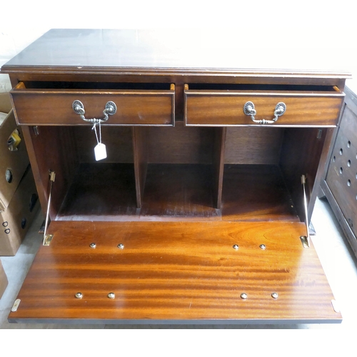 36 - An early 20thC oak chest with a fall front and a drawer  18