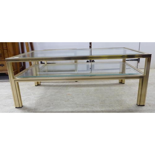 365 - A modern Pierre Vandel of Paris cast metal framed and bevelled glass, two tier coffee table, raised ... 