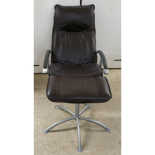 366 - A modern Hornselet, Denmark, reclining chair with a cast metal frame and stitched dark brown hide up... 