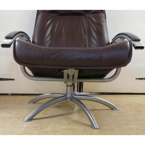 366 - A modern Hornselet, Denmark, reclining chair with a cast metal frame and stitched dark brown hide up... 