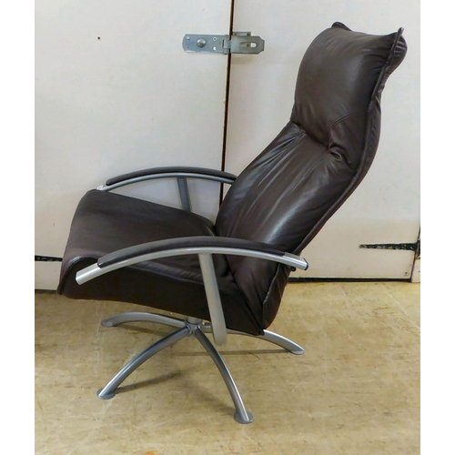 366 - A modern Hornselet, Denmark, reclining chair with a cast metal frame and stitched dark brown hide up... 