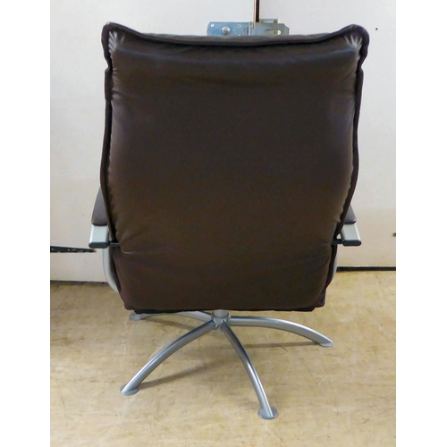 366 - A modern Hornselet, Denmark, reclining chair with a cast metal frame and stitched dark brown hide up... 