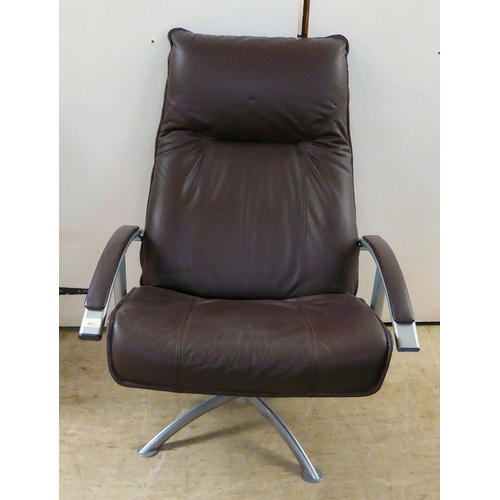 367 - A modern Hornselet, Denmark, reclining chair with a cast metal frame and stitched dark brown hide up... 