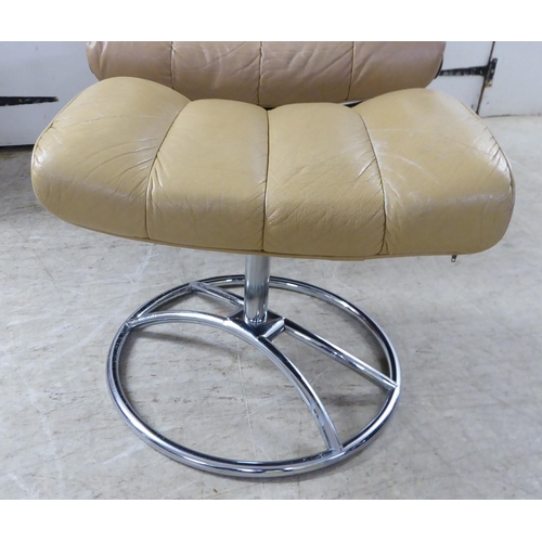 368 - A modern reclining chair, the chromium plated frame with cafe au lait coloured hide upholstery; and ... 