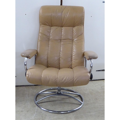 368 - A modern reclining chair, the chromium plated frame with cafe au lait coloured hide upholstery; and ... 