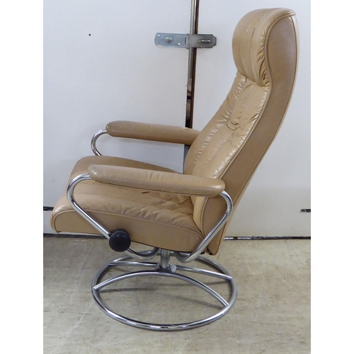 368 - A modern reclining chair, the chromium plated frame with cafe au lait coloured hide upholstery; and ... 