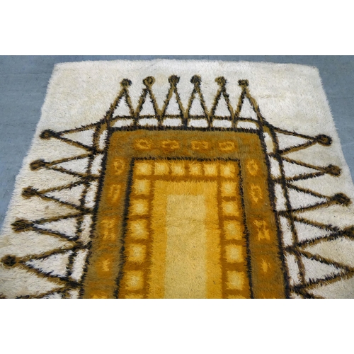 380 - A Swedish Rya rug  circa 1960s, decorated with a central rectangular panel, bordered by 'A' rep... 