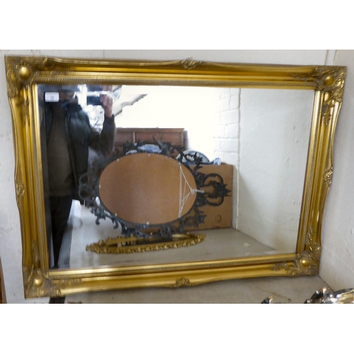 39 - Four dissimilar modern mirrors  variously framed  largest 30