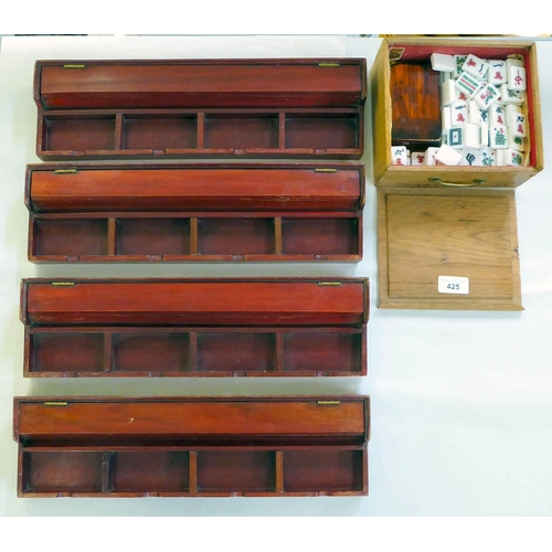 425 - A resin Mah-Jong set with four plywood counter trays