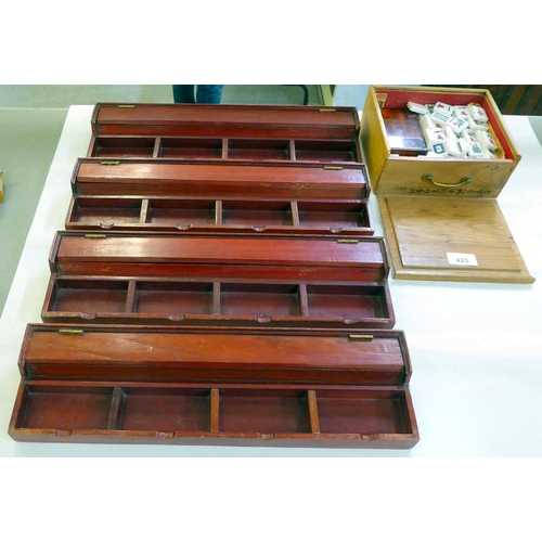 425 - A resin Mah-Jong set with four plywood counter trays