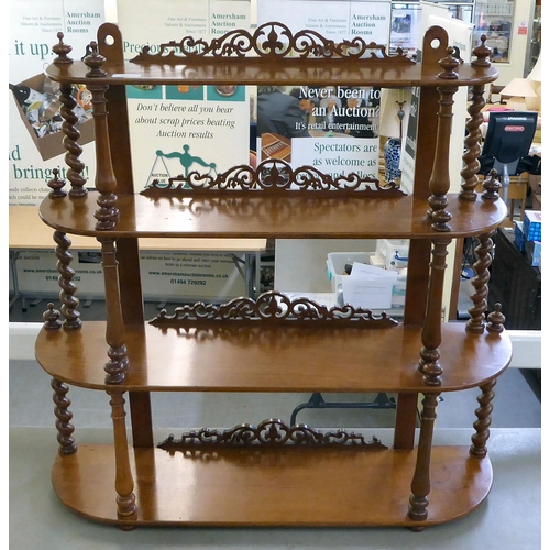 427 - A late Victorian and later mahogany waterfall front, four graduated tier hanging shelf with fretcarv... 