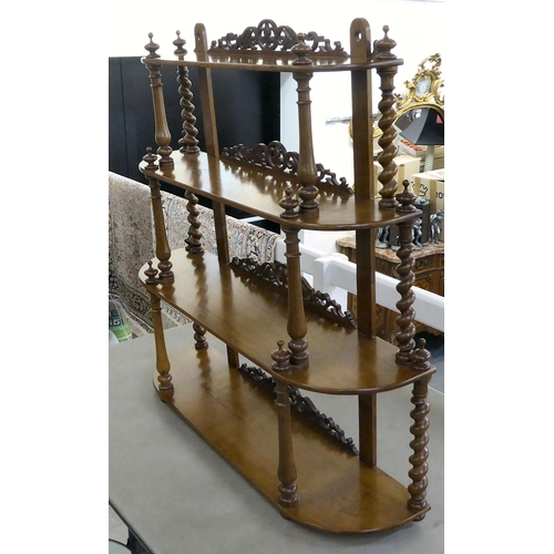 427 - A late Victorian and later mahogany waterfall front, four graduated tier hanging shelf with fretcarv... 