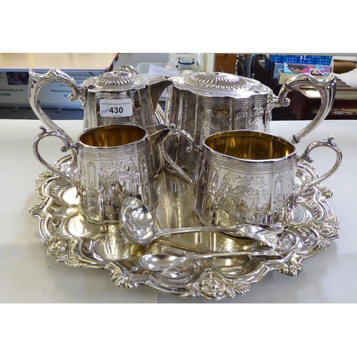 430 - A mixed lot: to include a late Victorian silver plated, four piece tea set, on tray  12