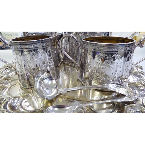 430 - A mixed lot: to include a late Victorian silver plated, four piece tea set, on tray  12