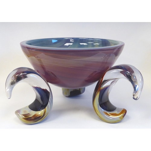 435 - A Murano glass bowl of basin design, elevated on three outset, C-scrolled feet, decorated in colours... 