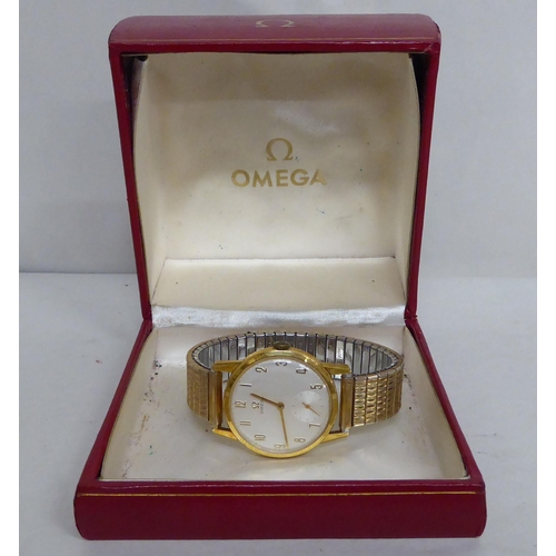 5 - An Omega gold plated wristwatch with a stainless steel cased and flexible strap, faced by an Arabic ... 