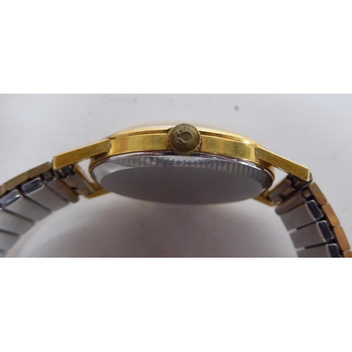 5 - An Omega gold plated wristwatch with a stainless steel cased and flexible strap, faced by an Arabic ... 