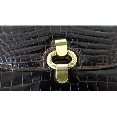 51 - A Gucci brown leather, snakeskin effect handbag with gilt metal mounts and strap