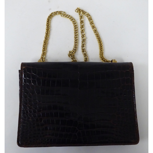 51 - A Gucci brown leather, snakeskin effect handbag with gilt metal mounts and strap