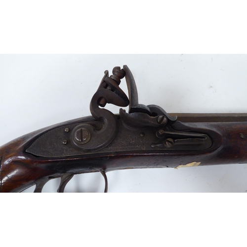 56 - A mid 19thC flintlock pistol with a walnut stock