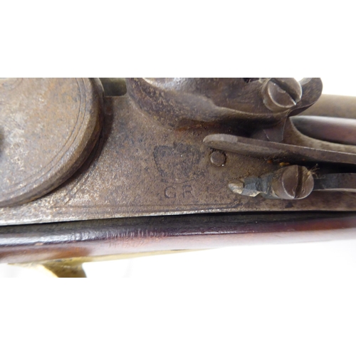 57 - An early 19thC flintlock pistol with a walnut stock