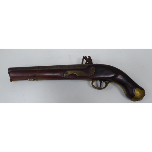 57 - An early 19thC flintlock pistol with a walnut stock