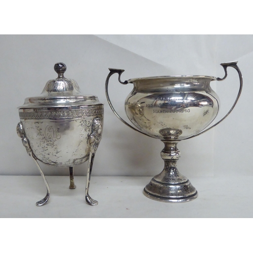 60 - A silver twin handled trophy; and a silver lidded sugar basin  mixed marks  (approx. gross 7ozs)