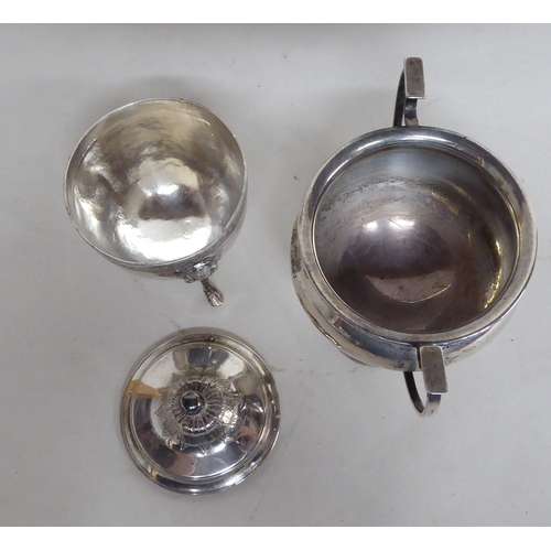 60 - A silver twin handled trophy; and a silver lidded sugar basin  mixed marks  (approx. gross 7ozs)