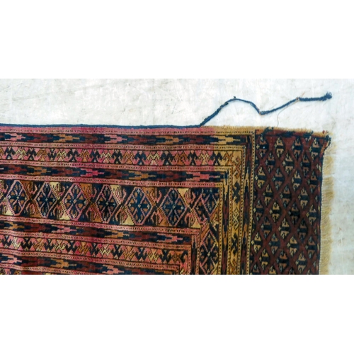 79 - A Bokhara rug, decorated with columns of guls and stylised border, on a red ground  50