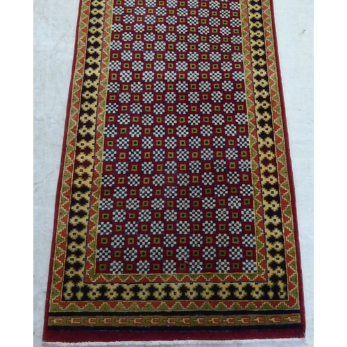 80 - A Senah runner, on a multi-coloured ground  32