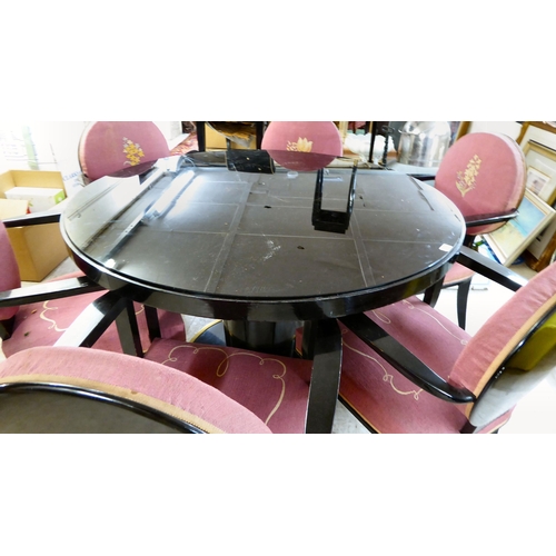 83 - A modern black painted pedestal dining table with a glass inset top  29.5