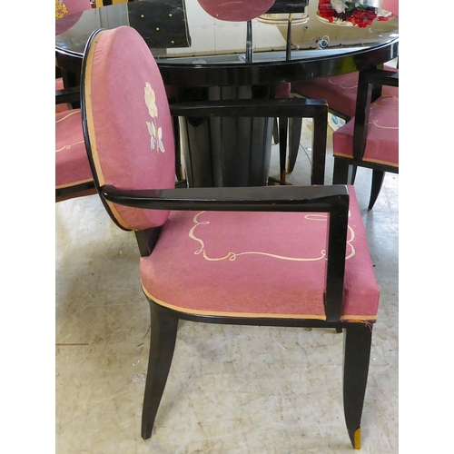 83 - A modern black painted pedestal dining table with a glass inset top  29.5